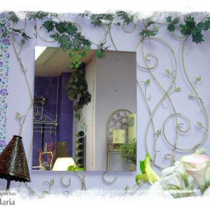 Espejo de forja con gran decoración de ramas y hojas y espejo de buen tamaño, pintado en crudo. LOSCAPRICHOSDEMARIA.COM